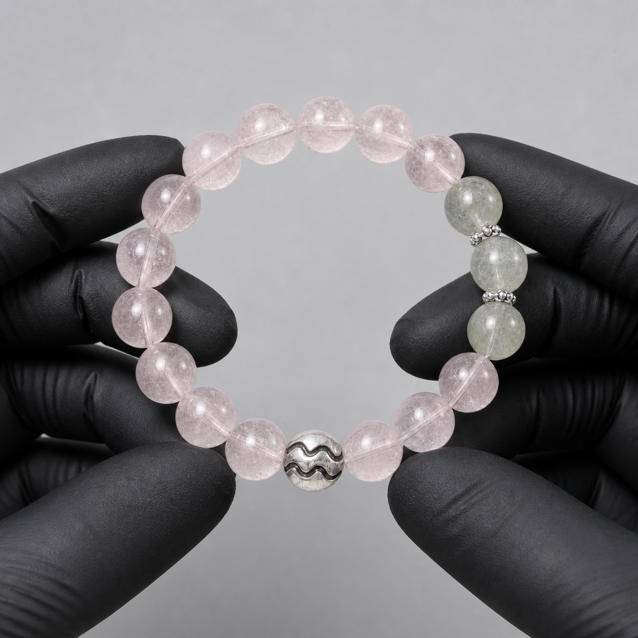 Aquarius crystal bracelet being inspected for crystal arrangement and finish details