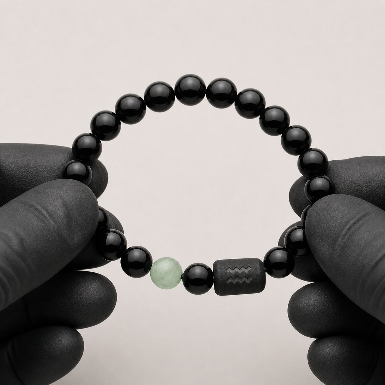 Aquarius zodiac bracelet being inspected for bead alignment and finish details