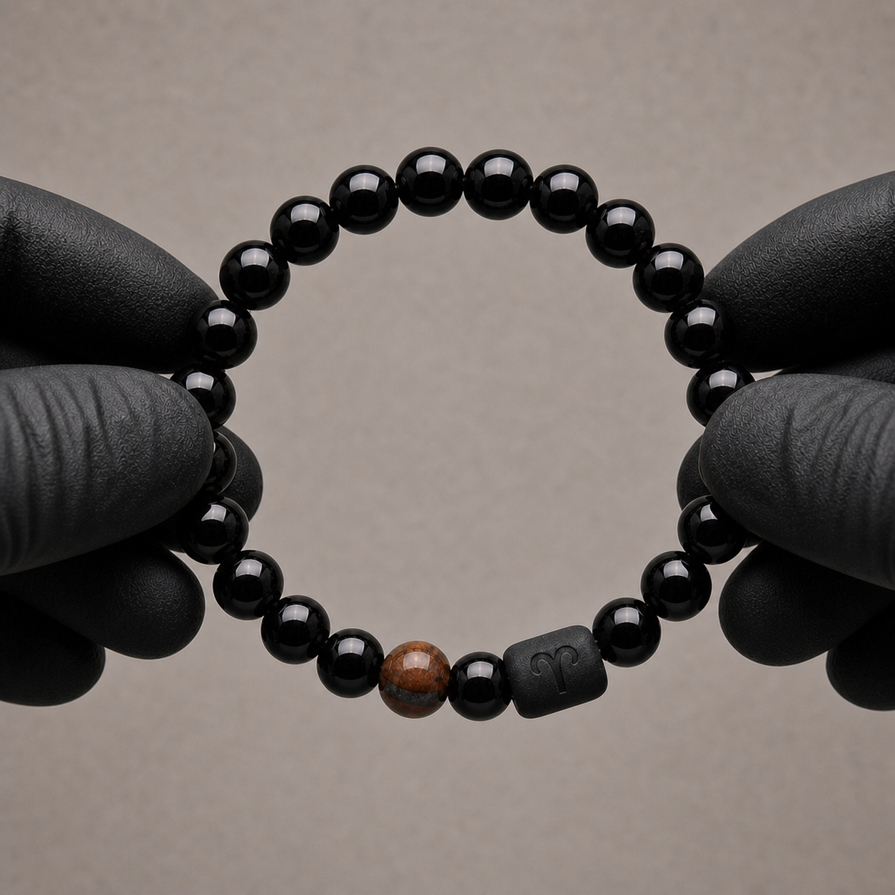 Obsidian and Tiger’s Eye Aries bracelet displayed in warm sunlight