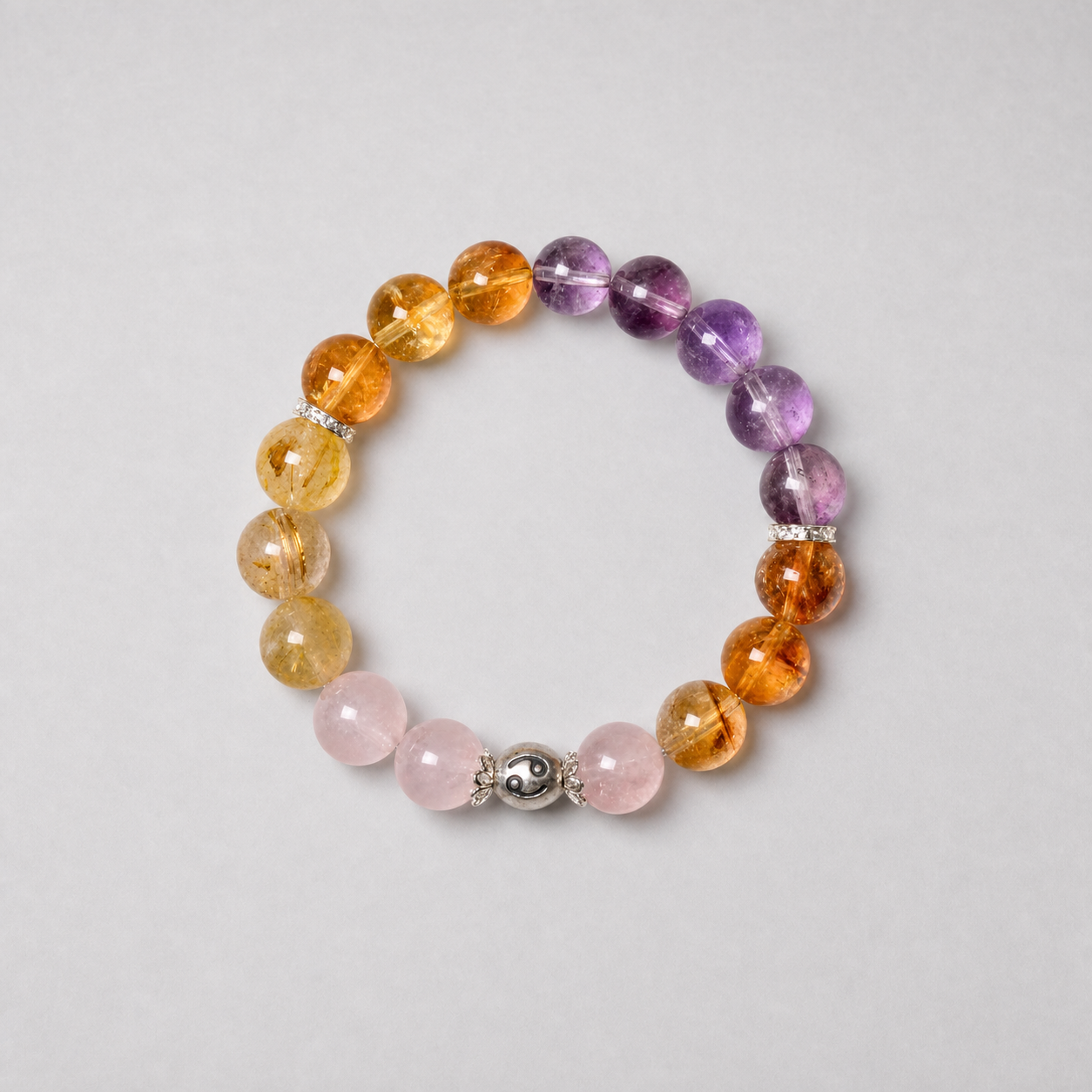 Cancer crystal bracelet with purple, pink and golden crystal beads in a refined styled setting