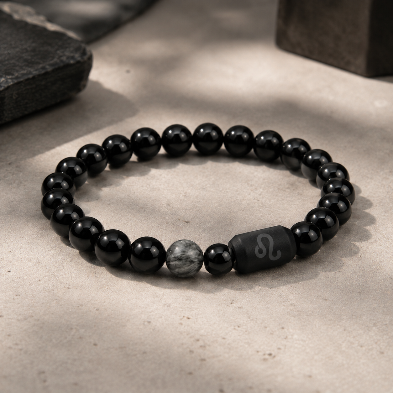 Leo zodiac bracelet with black obsidian and Tiger’s Eye beads in a dark styled setting