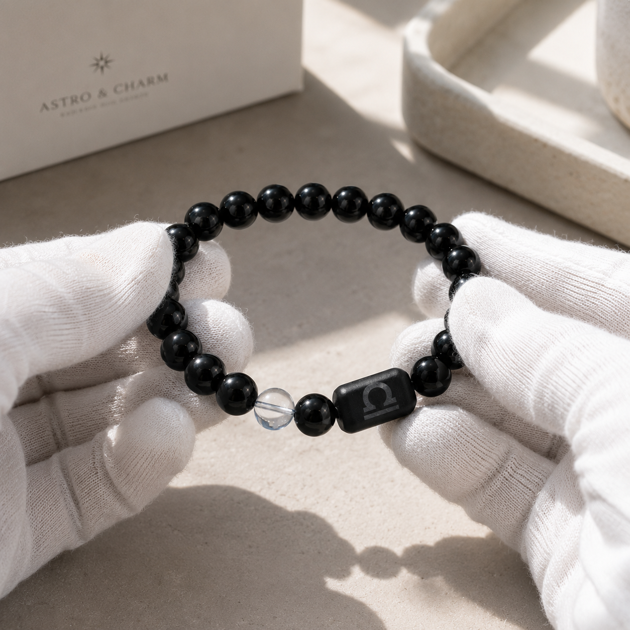 Libra zodiac bracelet being inspected for bead alignment and finish details