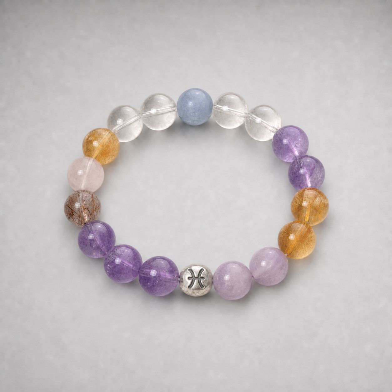 Pisces crystal bracelet with blue, purple, pink, clear and warm golden crystal beads in a refined styled setting