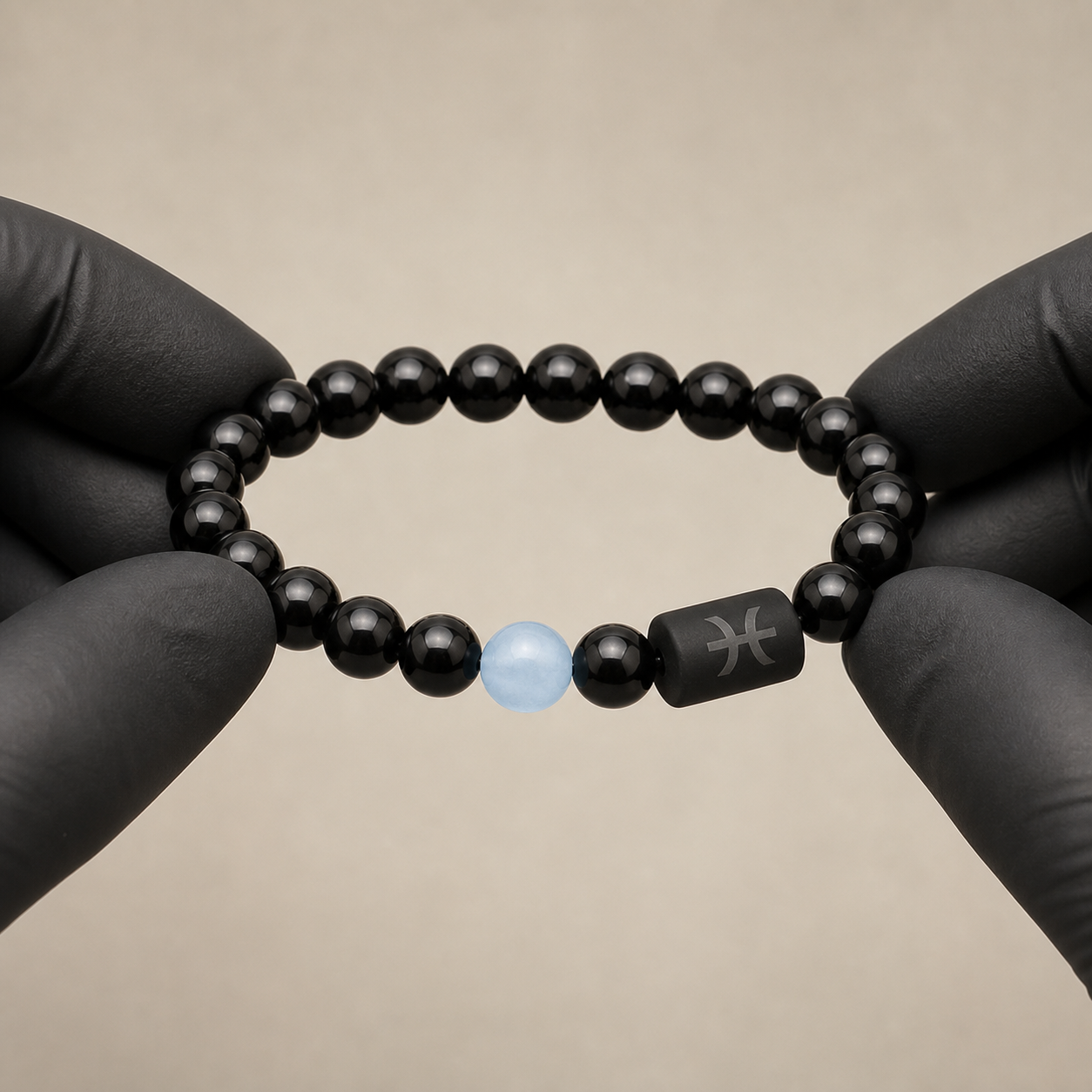 Pisces zodiac bracelet being inspected for bead alignment and finish details