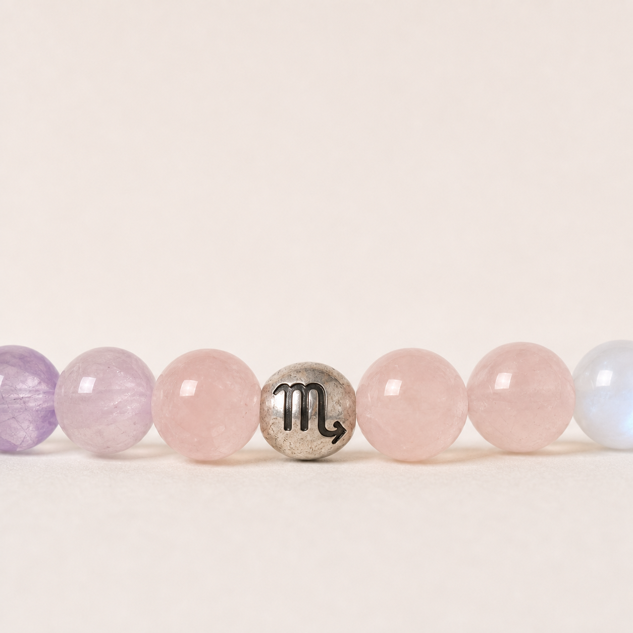 Close-up of Scorpio Crystal Bracelet with Amethyst, Kunzite, Rose Quartz and Blue Moonstone details