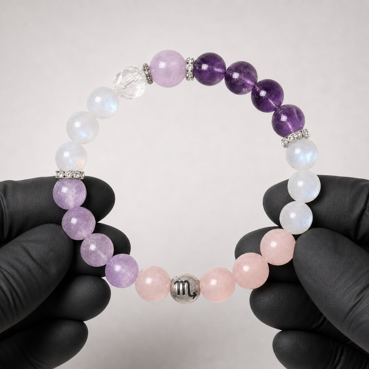 Scorpio crystal bracelet being inspected for crystal arrangement and finish details