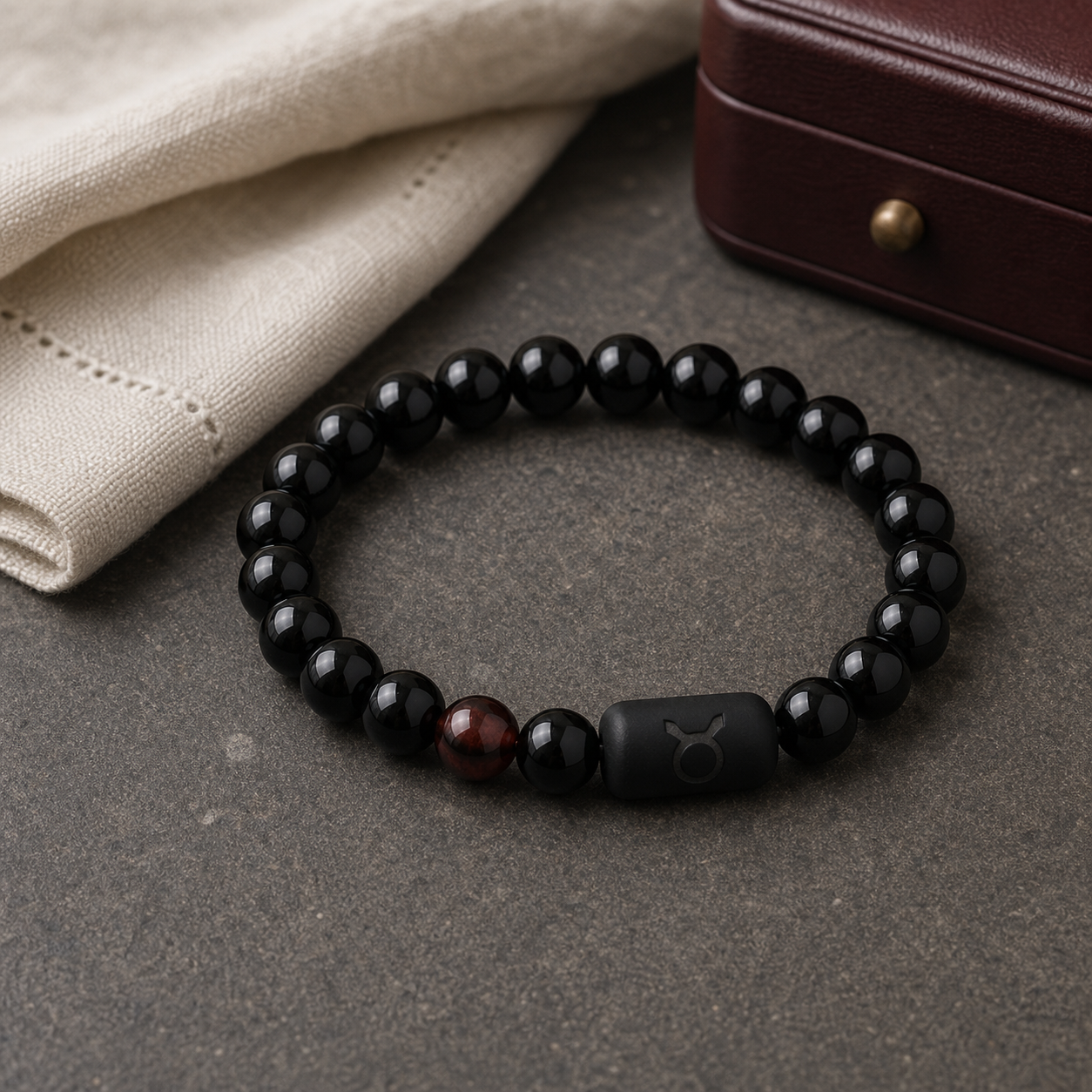 Taurus zodiac bracelet with black obsidian and Tiger’s Eye beads in a dark styled setting