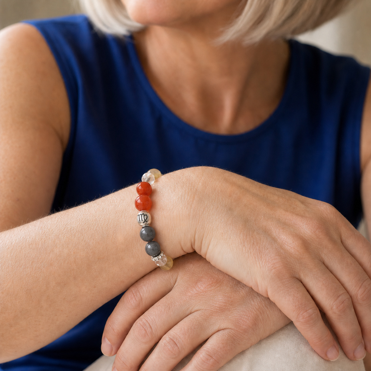 Woman wearing a Virgo Crystal Bracelet with Citrine, Nanhong Agate and Clear Quartz beads